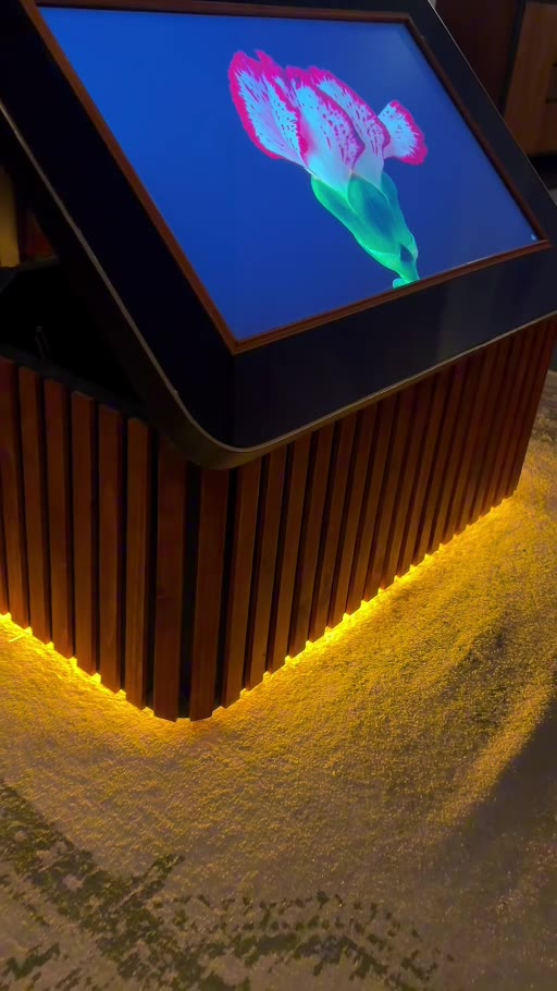 Interactive digital table with illuminated timber base