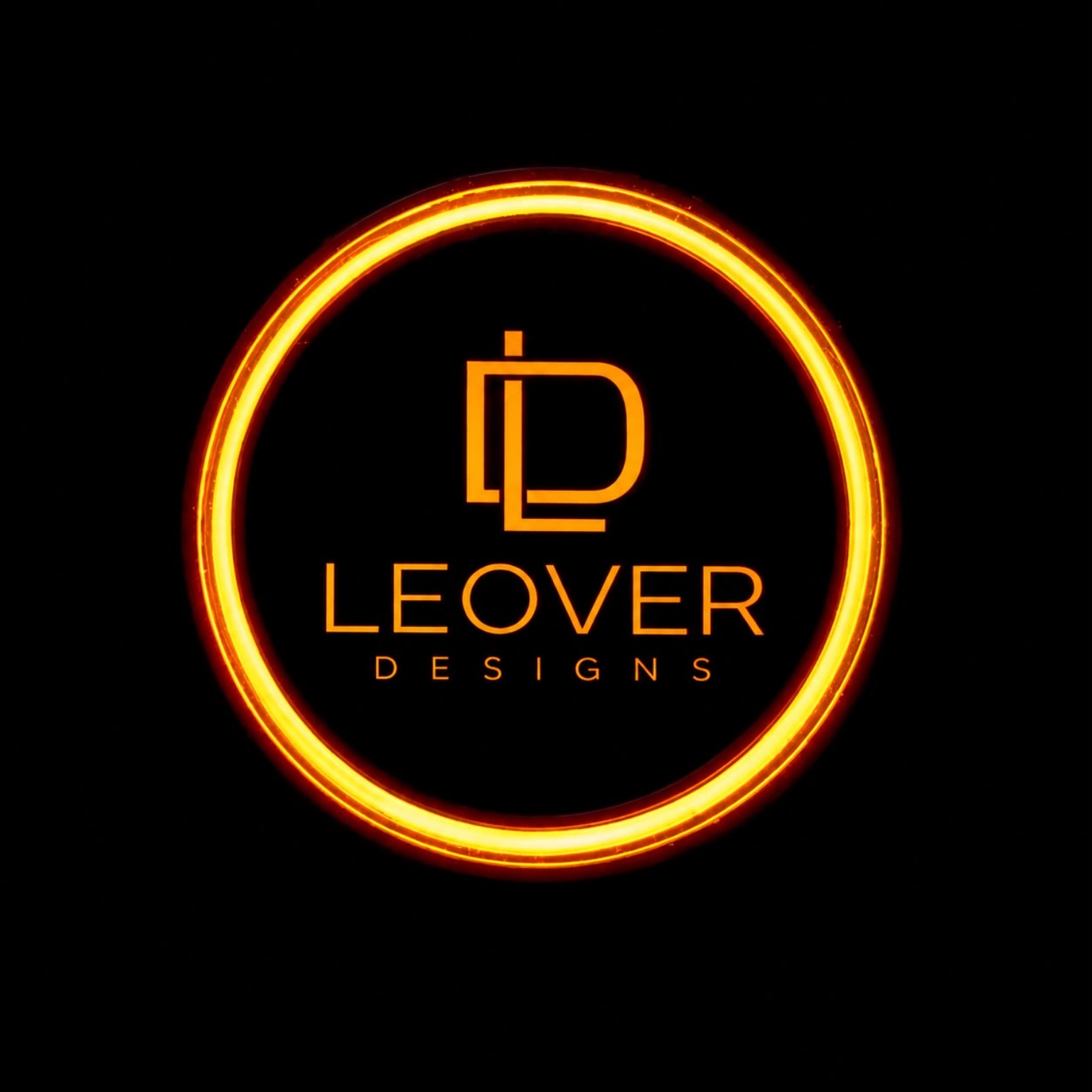 Illuminated orange LEOVER Designs studio mark